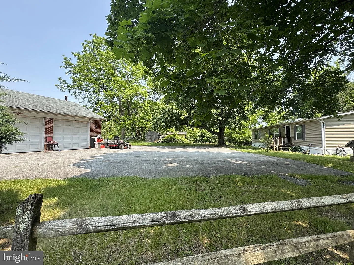 Garage + trailer on lot